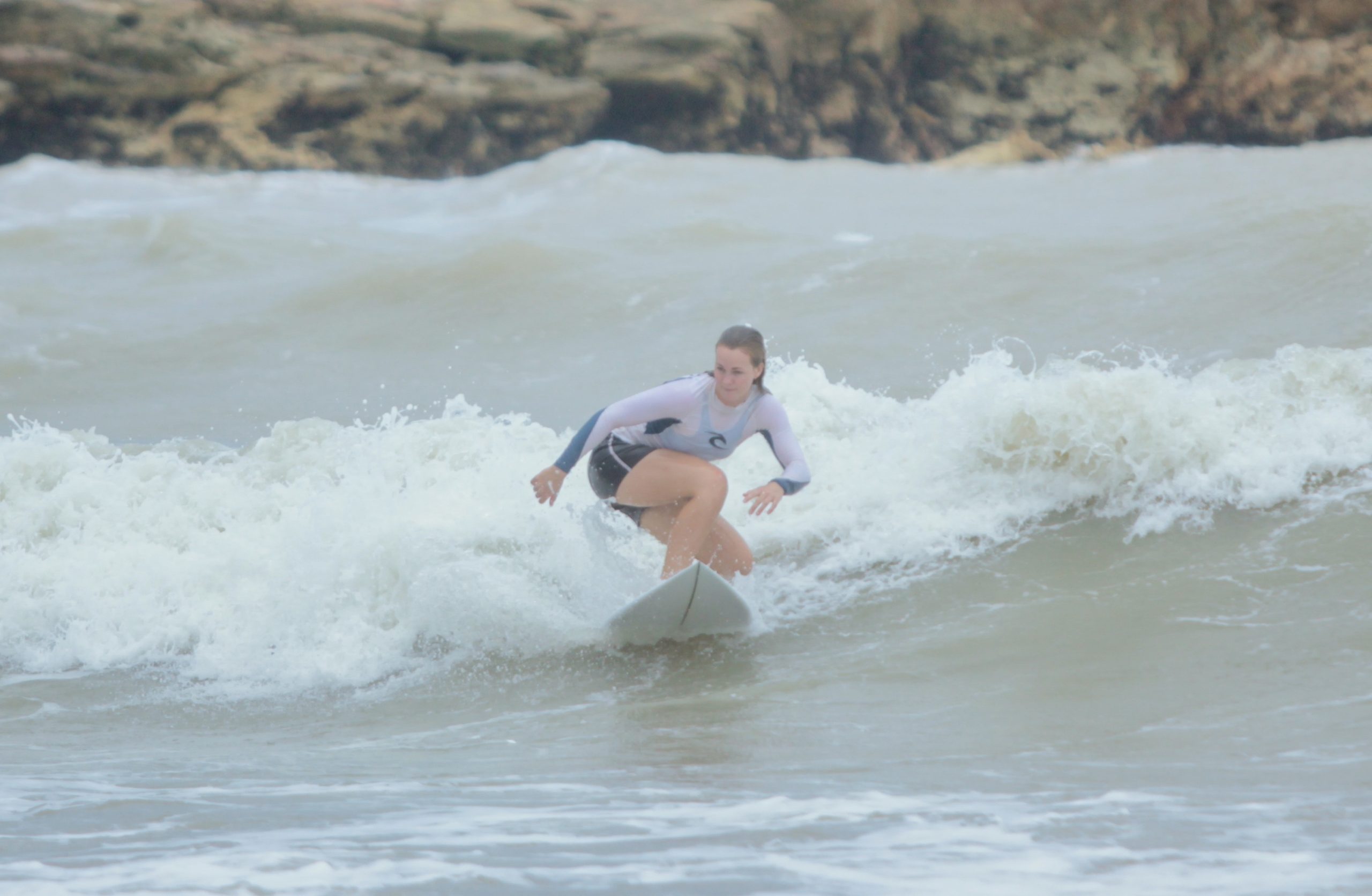 Nightcliff surfer during wet season stormy weather